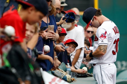 Tyler Naquin of the Cleveland Indians waits for his hat and glove