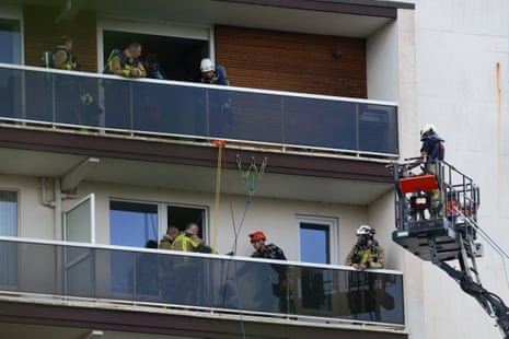 Rescuers work at the site of a fire in a building in Antwerp, Belgium.