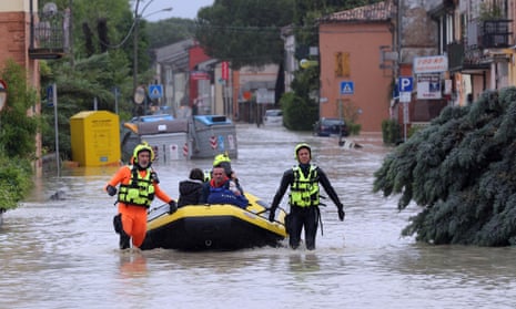 Firefighters rescue a family near Ravenna, central Italy
