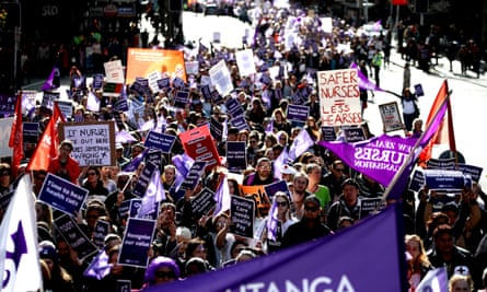 Nurses and Workers Union members march up Queen Street on 12 July in Auckland