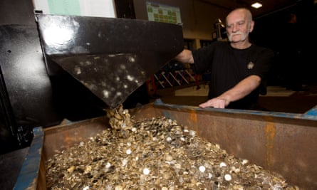 John Jones handles unminted £1 coins which will become some of the final round pound coins to be produced.