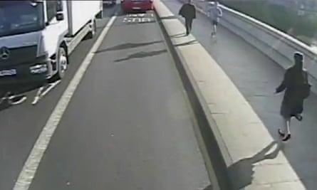 A still from surveillance footage shows the male jogger heading towards the woman on Putney Bridge.