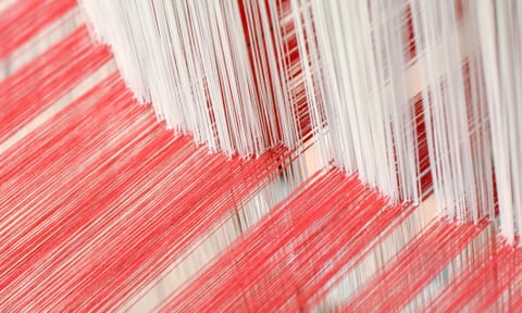 many threads of cotton on a loom
