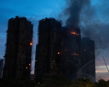 Smoke and flames rise at apartments blocks earlier on Thursday