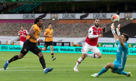 Adama Traore of Wolverhampton Wanderers lifts the ball over Arsenal keeper Emiliano Martinez and also over the bar.