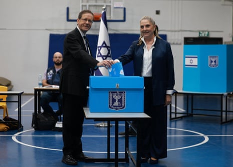 Israel’s president Isaac Herzog votes at a polling station in Jerusalem.