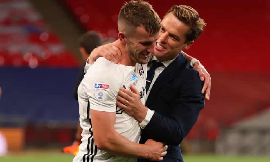 Fulham’s manager, Scott Parker, celebrates with his unlikely matchwinner Joe Bryan, who scored both their goals in the 2-1 win over Brentford at Wembley.