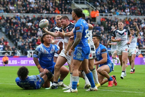 Elliott Whitehead of England celebrates with team-mates after scoring their side’s sixth try.