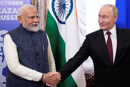 Narendra Modi and Vladimir Putin shaking hands