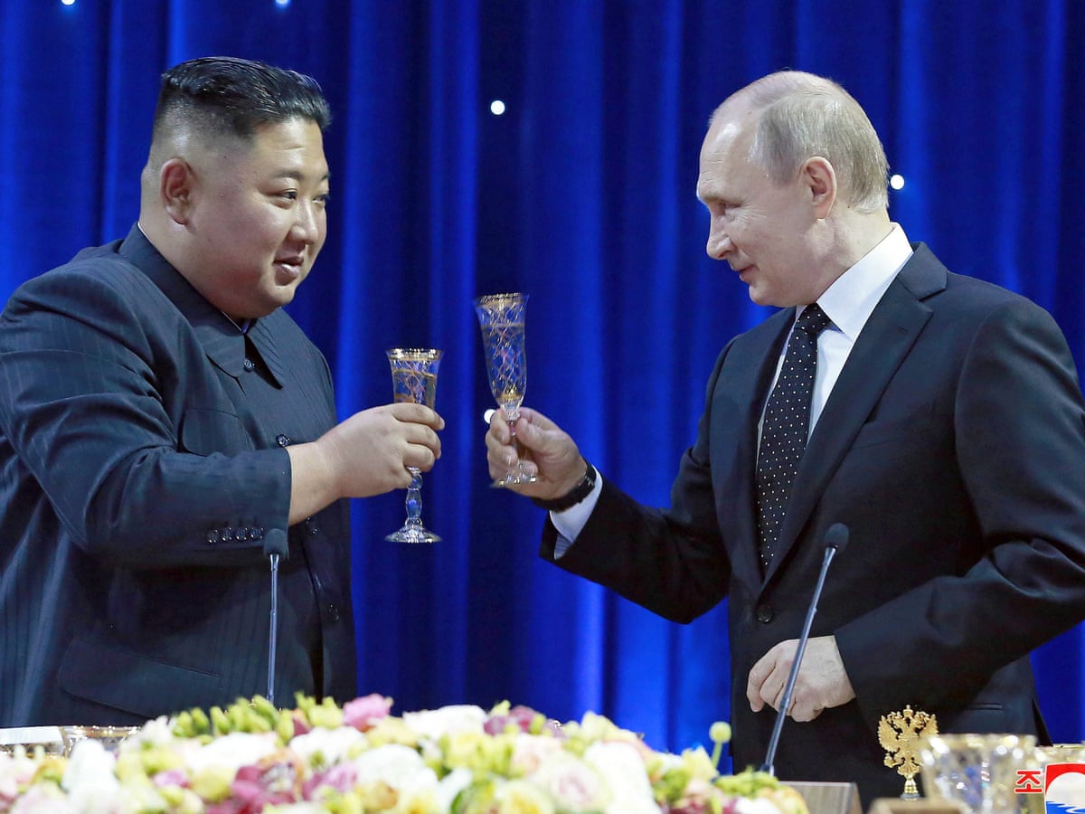 Kim Jong-un 'holds hands' with Vladimir Putin.