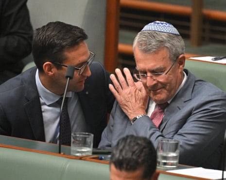 Labor member for Macnamara Josh Burns consoles Labor member for Issacs Mark Dreyfus after speaking on the condolence motion.