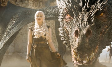 Daenerys standing in front of a dragon