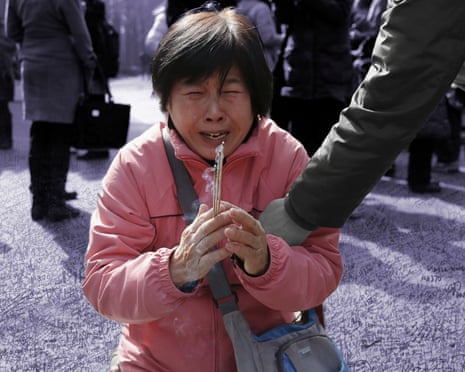 A woman in China pleads for action to find out what happened to missing Malaysia Airlines flight MH370.