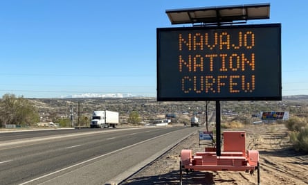 A road sign outside Bloomfield, New Mexico, warns Navajos to stay home during their nation’s 8pm to 5am curfew to slow the spread of the coronavirus.
