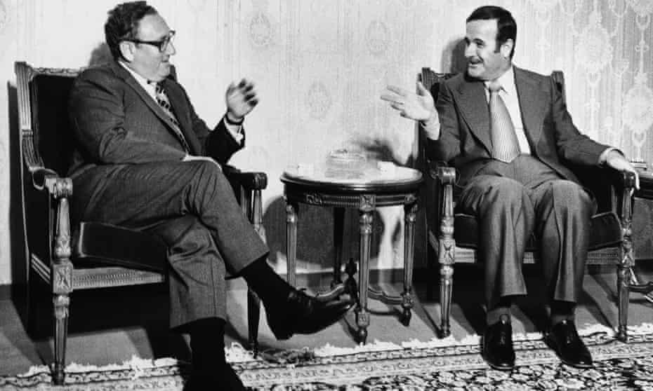 Henry Kissinger and Syrian president Hafez Assad hold talks on peace between Israel and the Arab state in Damascus, Syria in August 1975.
