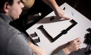 Adrien Stranieri plays dominoes with his mother, Catherine Chavy