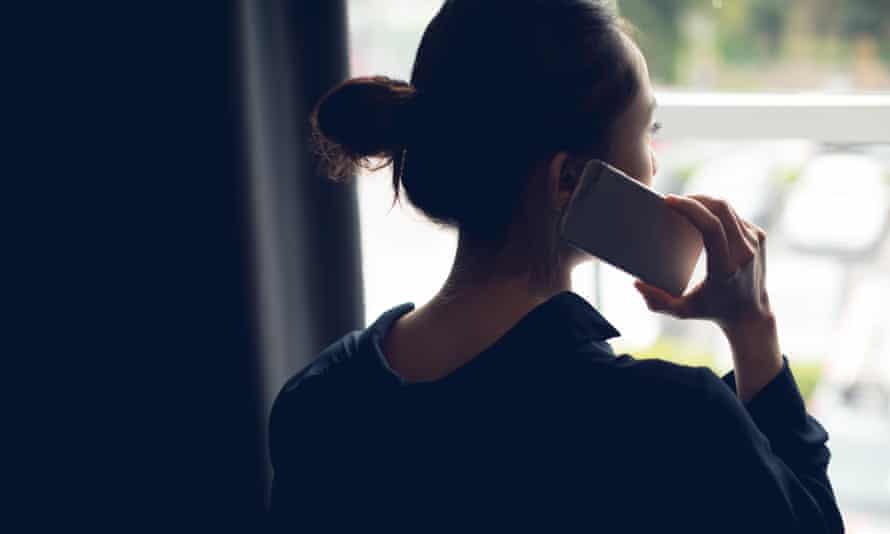 Rear view of woman talking on mobile phone