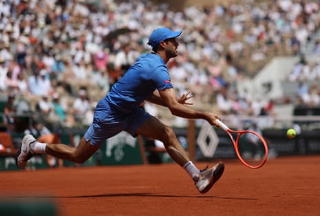 Nuno Borges dashes across court to make a forehand return to Andrey Rublev.