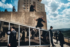 Street Photography - 2nd Place | Jerusalem 2018 by Barry Talis. Orthodox men on building