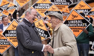 Ed Davey is congratulated by a local supporter at a rally in Winchester