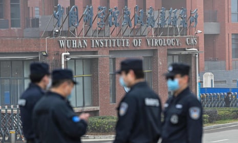 Security personnel stand guard outside the Wuhan Institute of Virology in Wuhan.