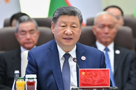 Xi sat speaking others behind