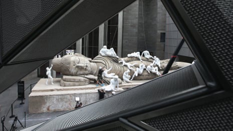 Giant Buddha reclines with western statues in National Gallery of Victoria foyer – video 