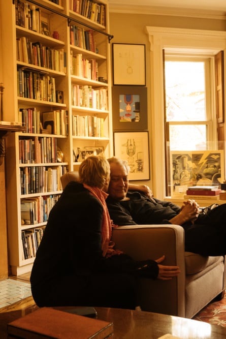Authors Siri Hustvedt and Paul Auster sitting in a room lined with bookshelves, in spring 2024