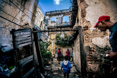 Isaac, 3, in the ruins of his house on 62 Cuba Street