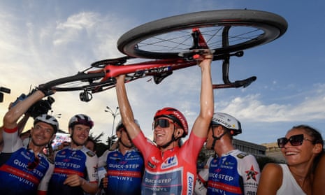 Remco Evenepoel celebrates his Grand Tour triumph.