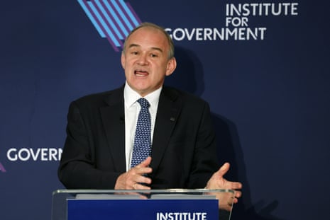 Liberal Democratic leader Ed Davey delivering a speech on stage.