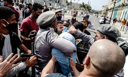 A man is arrested during a demonstration against the government of Cuba’s President Miguel Díaz-Canel in Havana.