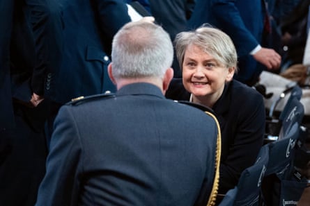 Yvette Cooper chats to a military man at the Munich Security Conference