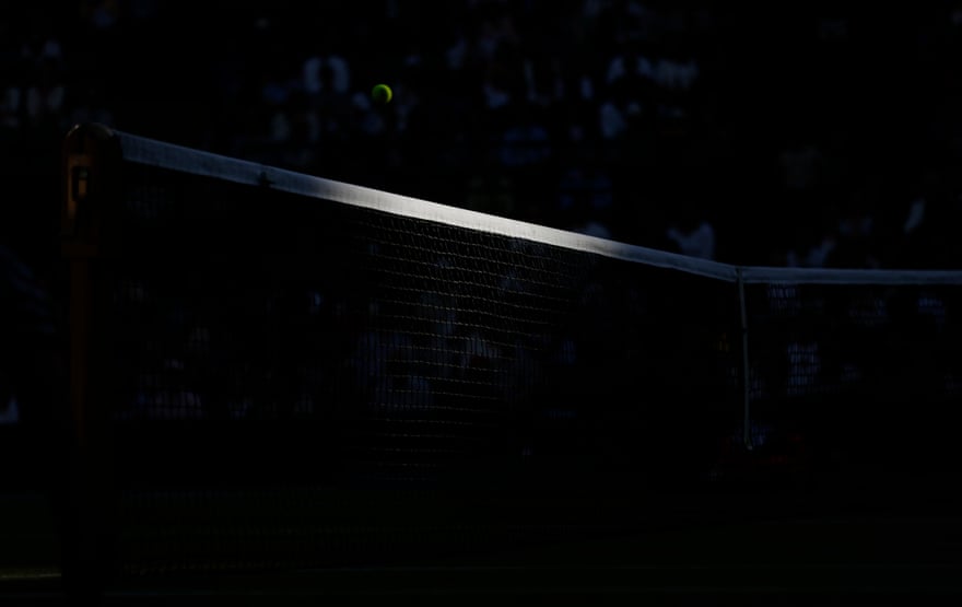 Tom Jenkins’ best shots of Wimbledon 2022 – in pictures | Wimbledon 2022 8 The last of the sun hits the net on Court One.