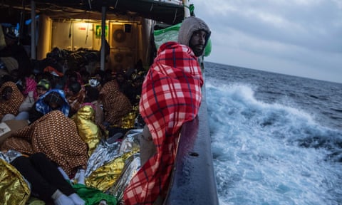 Refugees and migrants aboard the Golfo Azzurro after being rescued off the Libyan coast