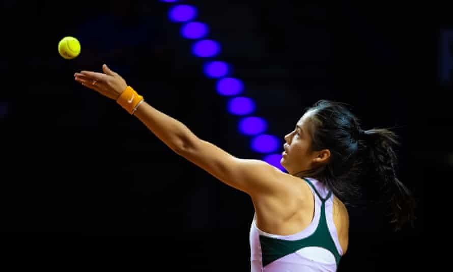 Emma Raducanu serves at the indoor Porsche Arena.