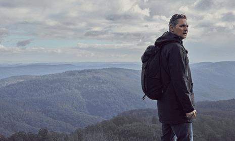 Eric Bana wearing a backpack in the mountains in the 2023 film Force of Nature, an adaptation of Jane Harper's novel