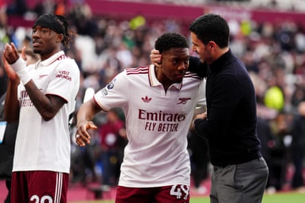 Myles Lewis-Skelly (centre) and Mikel Arteta celebrate after the win over West Ham.