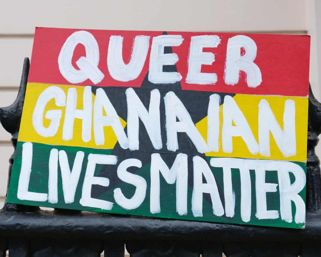 A placard saying ‘Queer Ghanaian Lives Matter’ is placed outside the Ghanaian High Commission in London