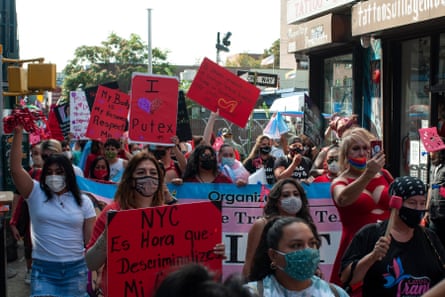people march with bright-red signs. one says ‘my body is my business - respect me’