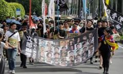Hong Kong activists hold a banner supporting the Hong Kong 47 and other political prisoners during a protest in Taipei, Taiwan, on Sunday.