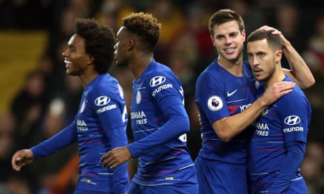 Eden Hazard is congratulated by his Chelsea teammates after scoring his side’s winner at Watford from the penalty spot