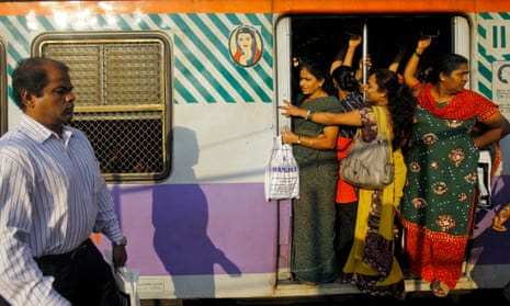Indian women in the ladies compartment of a train on their way to work in Mumbai, India
