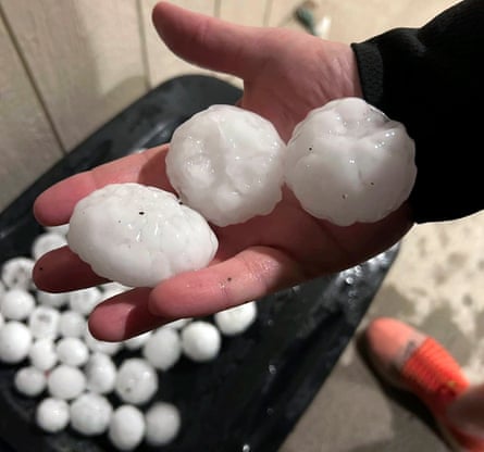 In this image provided by Jeremy Crabtree, large chunks of hail are shown