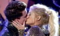 Charlie Puth and Meghan Trainor kiss after performing together during the 2015 American Music awards