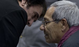 Francisco Gómez, right, the man who raised Guillermo Pérez Roisinblit, talks to his lawyer during a trial against Gomez and the former head of Argentina’s air force for the forced disappearance of Perez’ biological parents.