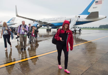 Beck Dorey-Stein walks from Air Force One with members of the White House press pool in Laos in 2016.