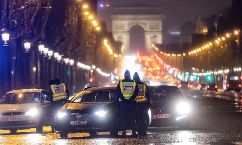 French police at a checkpoint on the Champs-Élysées earlier this month to check drivers’ authorisations to be outdoors beyond the 6pm curfew