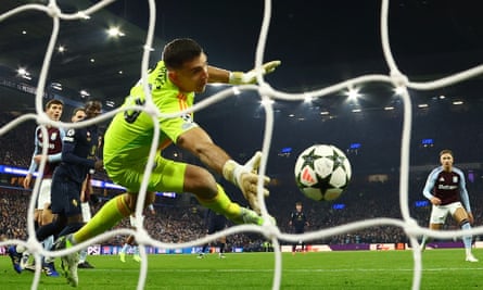 Aston Villa keeper Emiliano Martínez makes a dramatic save to deny Francisco Conceição.