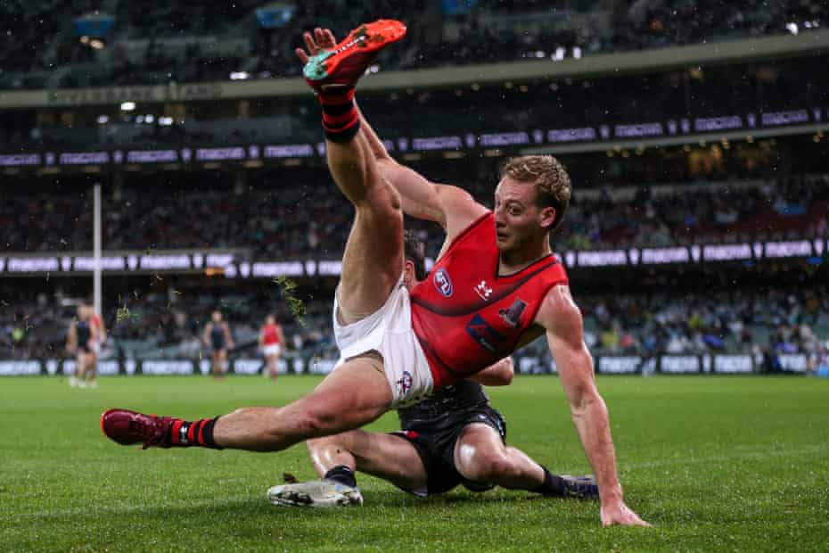 Darcy Parish is tackled by Port Adelaide’s Zak Butters during Essendon’s most recent AFL defeat, on Sunday at Adelaide Oval.